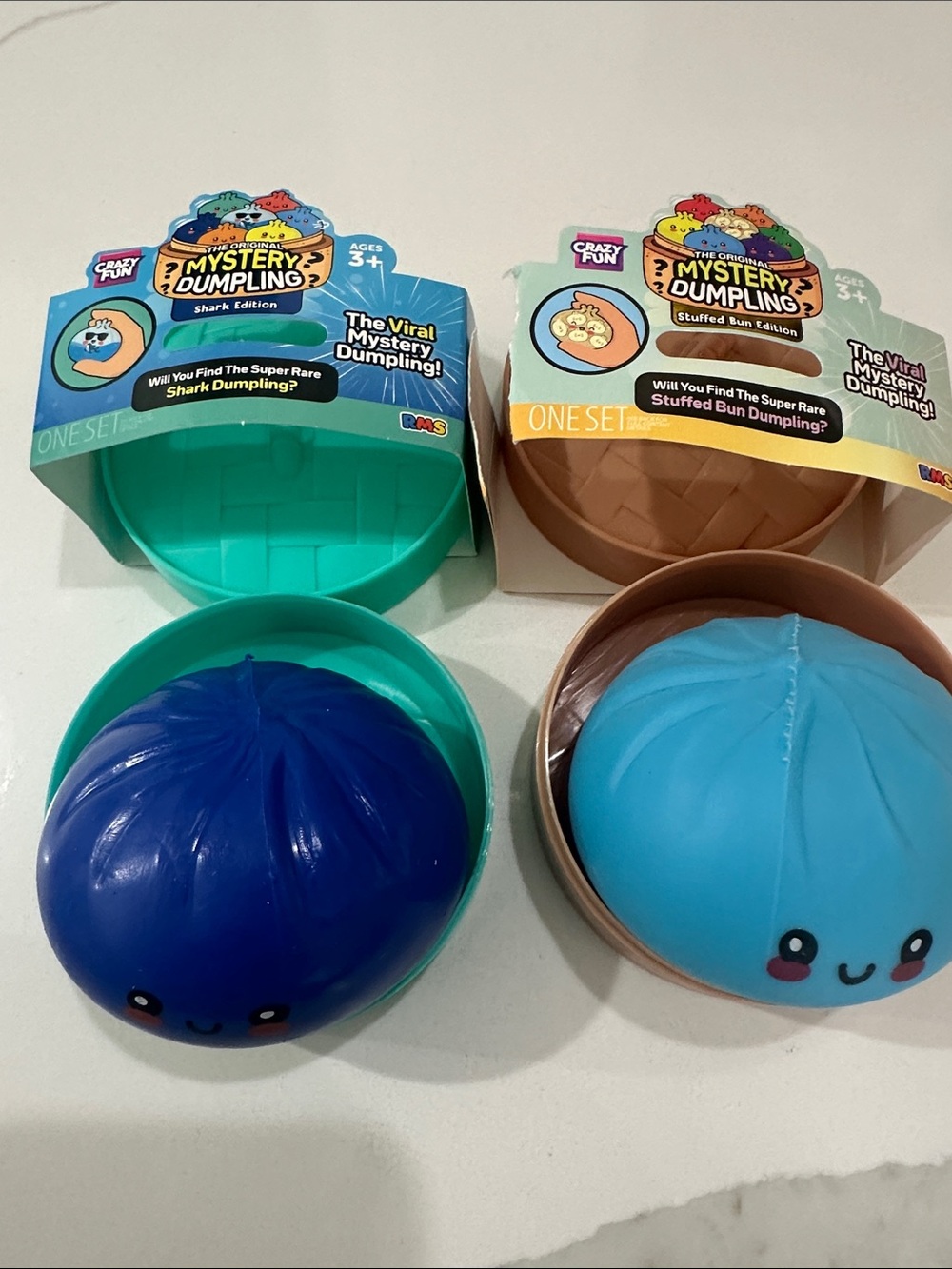 Set of 2 like new RMS Original Mystery Dumplings stuffed bun and shark edition